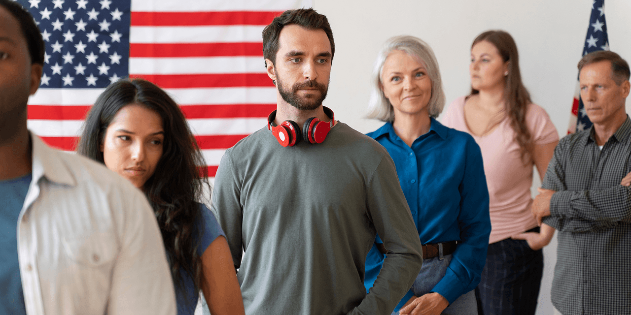 Diverse group of people in front of American flag